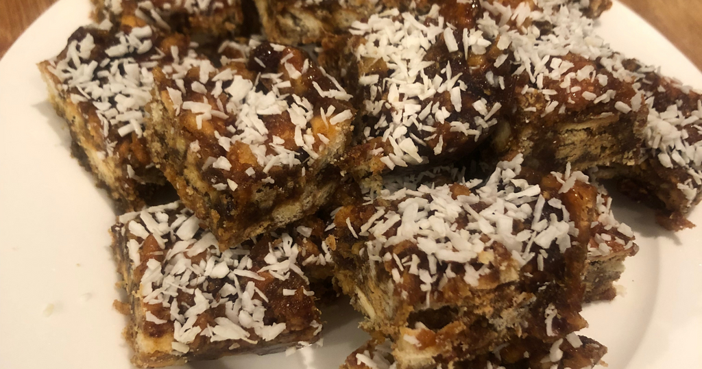 Date Squares dessert with a crumbly oat topping and date filling on a plate