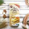 Bakers Provita Wholewheat Crispbread 500g box on a rustic wooden table with scattered crispbread pieces.