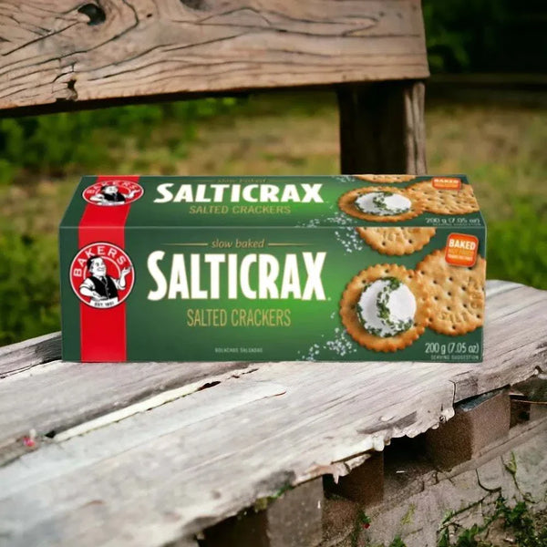 Bakers Salticrax Salted Crackers - 200g box on wooden bench outdoors.
