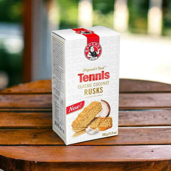 Bakers Tennis Classic Coconut Rusks 450g pack on a wooden table.