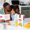 Father and daughter enjoying a heartfelt moment with Bakers Tennis Classic Coconut Rusks, perfect with coffee or juice for Father's Day breakfast.