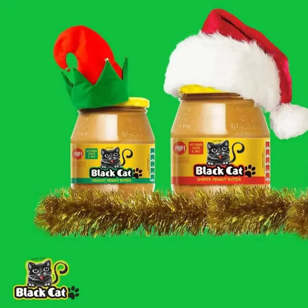 Black Cat peanut butter jars in a festive Christmas display