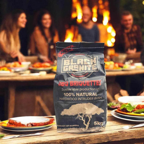 Black Granite Briquettes 5kg bag on an outdoor table, ideal for sustainable BBQ grilling.