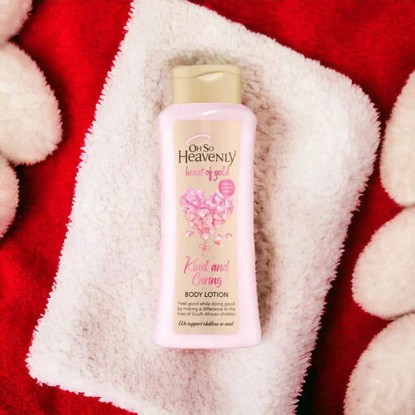 Oh So Heavenly Heart of Gold Body Lotion (720ml) on a soft towel, ideal for hydrating and brightening skin.
