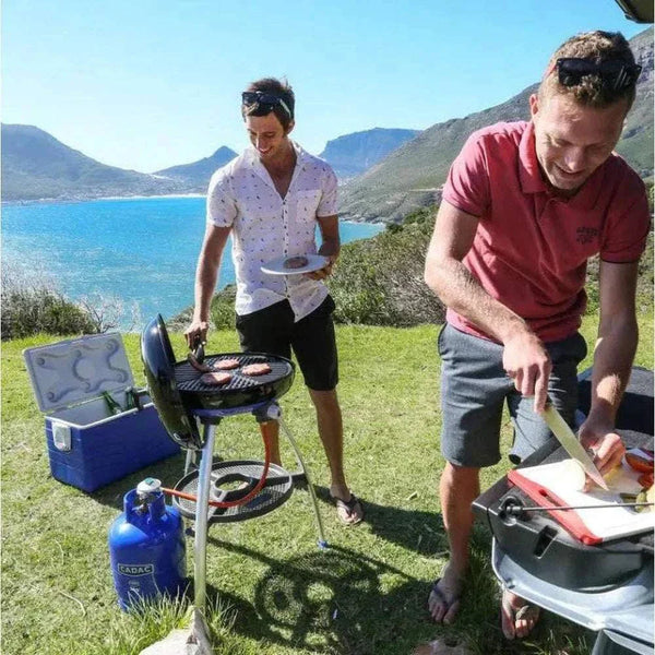 Outdoor cooking with CADAC Carri Chef 50 gas BBQ by the sea.