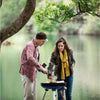 Couple cooking on a CADAC Carri Chef 50 gas BBQ outdoors.