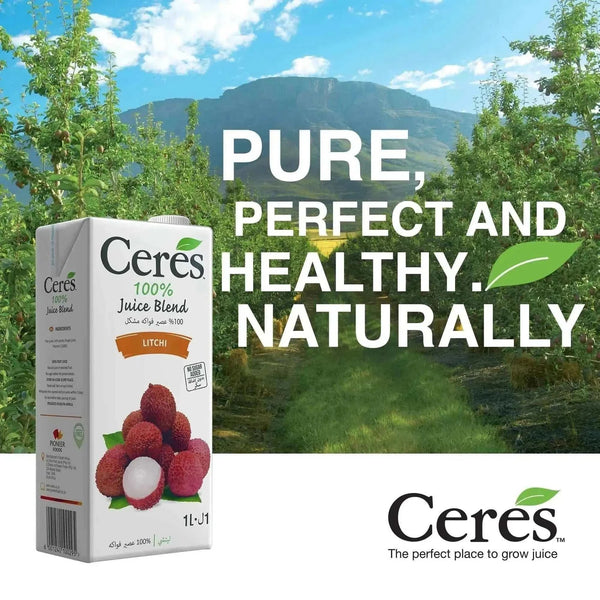 CERES Litchi Sensation juice carton in a lush orchard setting; pure, healthy, and natural beverage.