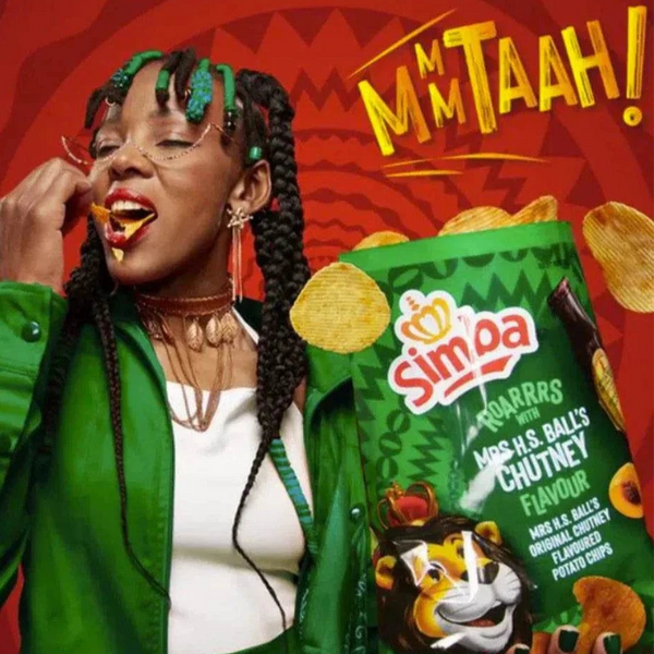 Simba Mrs Balls Chutney maize snacks with person enjoying chips in vibrant packaging.