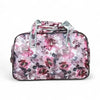 Light pink Cotton Road travel bag with purple rose print and adjustable strap