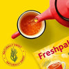Freshpak Rooibos Tea 80's package with red teapot pouring rooibos tea into cup on yellow background