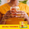 Freshpak Rooibos Tea box with a person holding a steaming cup, highlighting caffeine free, antioxidant rich, preservative free, and naturally sweet features