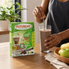 Adult preparing a Futurelife Zero Chocolate 500g meal replacement shake at breakfast
