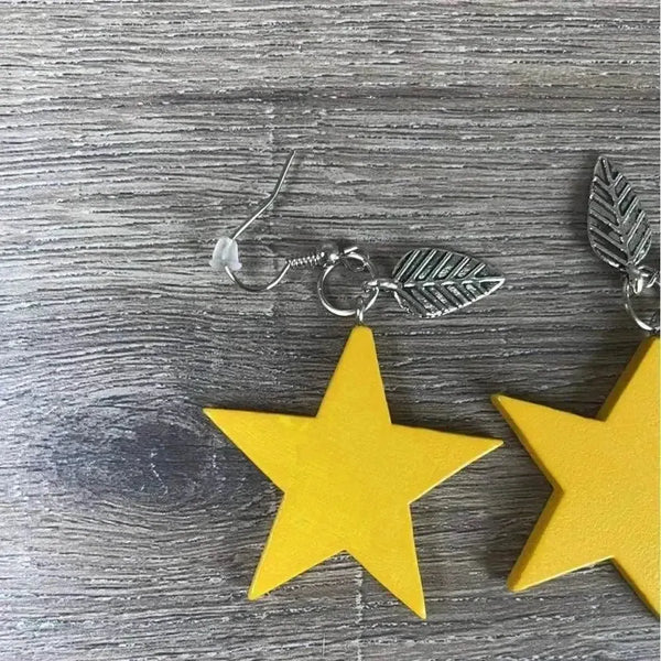 Hanging earrings mustard wooden stars 40mm sold in pairs