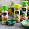 Ina Paarman Lemon & Black Pepper seasoning 200ml bottle on kitchen counter with vegetables and green onion seasoning.