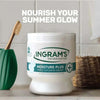 Ingrams Moisture Plus Triple Glycerine Cream 450g for deep hydration on wooden bathroom counter.