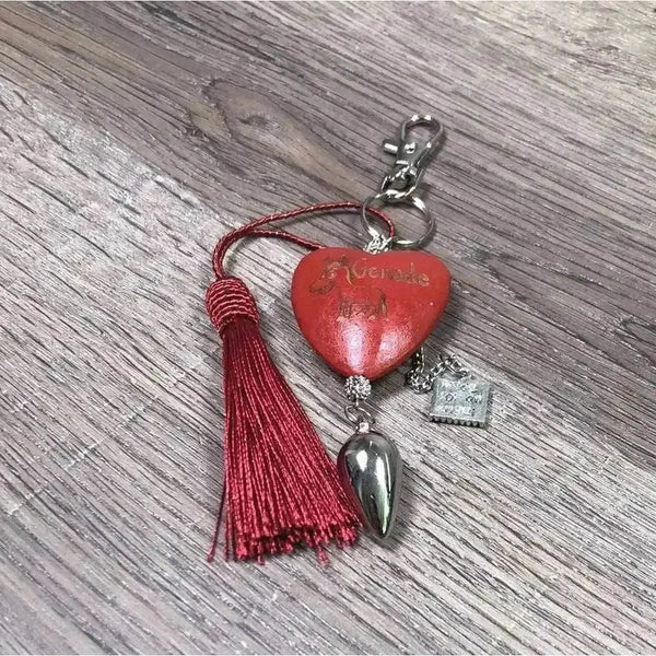 Red heart-shaped keyring with donkey and "Genade" text, 50mm size
