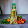 Knorr Vinaigrette Greek Salad Dressing bottle with fresh tomatoes and leafy greens around it