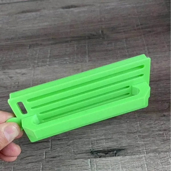 Green medium-sized plastic Koeksister cutter for shaping traditional Afrikaans fried dough pastries