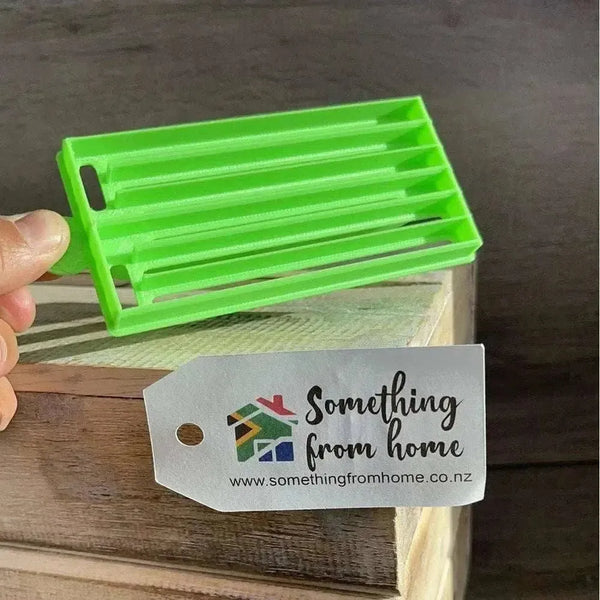 Green medium-sized plastic Koeksister cutter for making traditional braided Afrikaans dough pastries