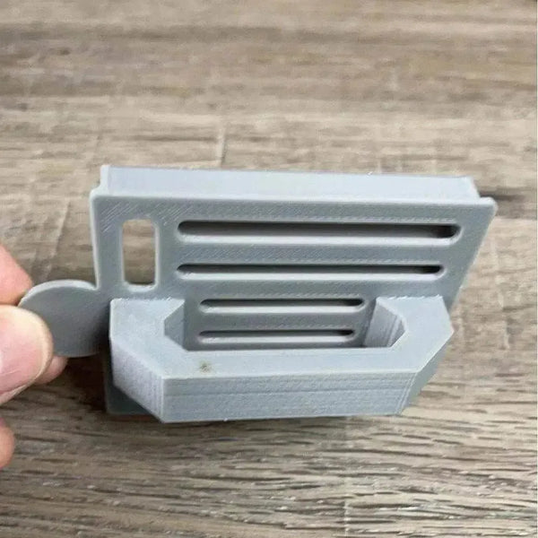 Small grey plastic Koeksister cutter for traditional braided fried dough pastry