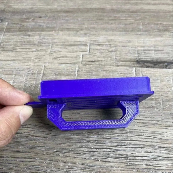 Purple small plastic Koeksister cutter for shaping traditional Afrikaans fried dough pastries