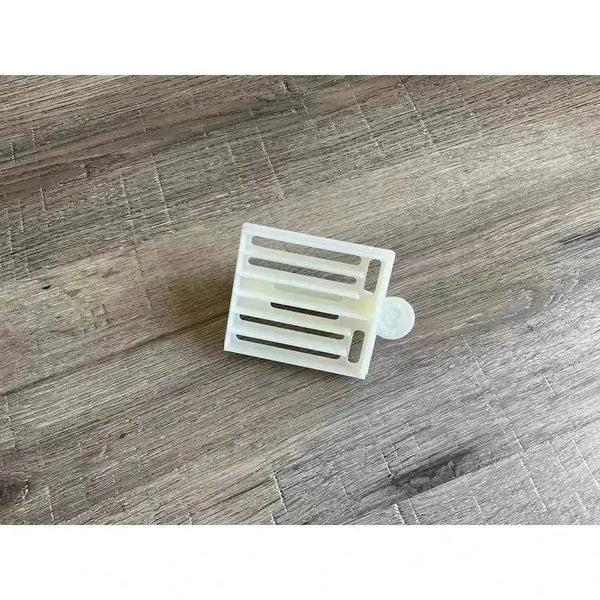 Small white plastic Koeksister cutter for traditional dough braiding and frying