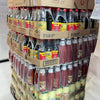bulk pallet of assorted 700ml All Gold Tomato Sauce bottles and condiments in a warehouse