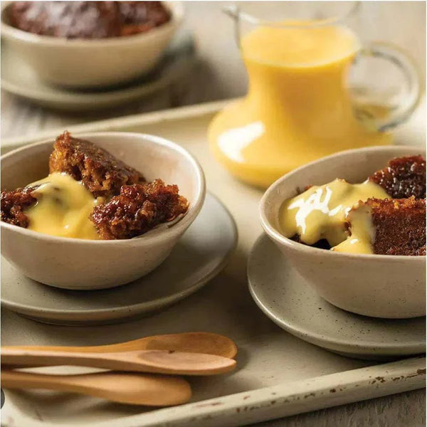 Malva Pudding served with custard, showcasing Snowflake Creations' convenient dessert kit.