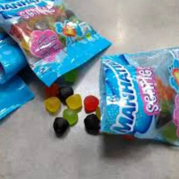 Maynards Senties gummy sweets 50g packs with colorful chewy candies on a table.