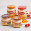 Melrose Cheese Spread - Bacon 400g jars displayed with other flavors and tomatoes.