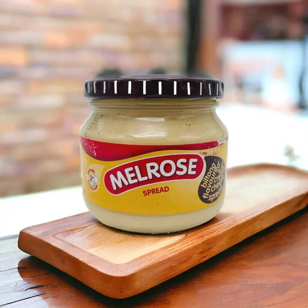 Melrose Cheese Spread Biltong 250g jar on wooden board, creamy and versatile.