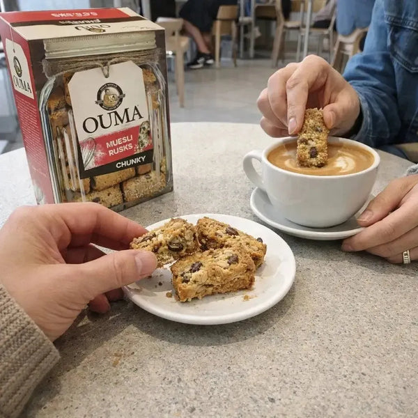 Ouma Rusks Muesli 1kg box with crunchy oats, peanuts, coconut, and raisins for a high-fibre South African breakfast snack