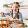 young girl spreading smooth Black Cat peanut butter on bread in kitchen with 400g jar nearby