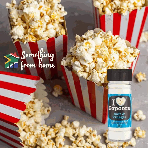Popcorn Delight Cheddar Salt & Vinegar Spice seasoning jar with freshly popped popcorn.