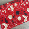 Red tablecloth with Afrikaans sayings and dimensions 275cm by 140cm