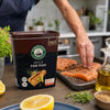 Robertsons Fish Spice 1kg beside seasoned salmon in a home kitchen