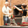 Rooibaard Tabaardsco Groen Sauce 250ml on table with grill scene.