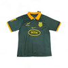South African Rugby Supporter Jersey in dark green with orange collar and sleeve cuffs, featuring team logos and MTN sponsor, made with breathable DRI-FIT fabric, size X Large.
