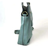 Green PU leather sling bag with buckle and adjustable strap