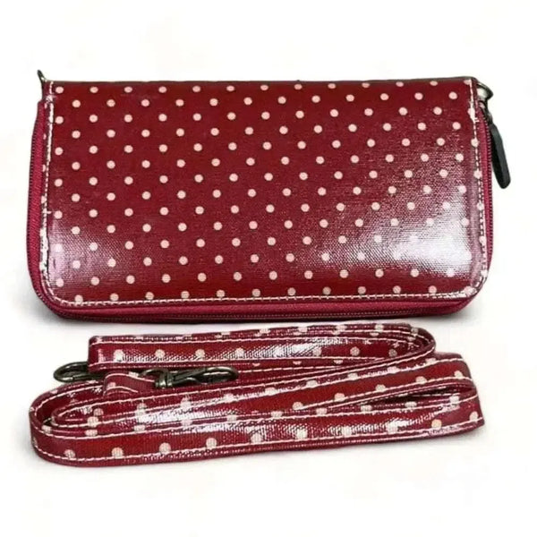 Red sling wallet with small dots and removable shoulder strap