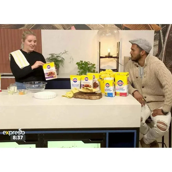 Malva Pudding Kit demonstration on a TV show set with Snowflake products.