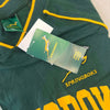 Green Springbok Official Licensed Supporter T-Shirt with yellow trim and logos, featuring embroidered Springbok logo and tags.