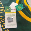 Close-up of green and gold Springbok Official Licensed Supporter T-Shirt tag with SA Rugby logo and Pick n Pay partnership label