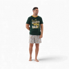 Man wearing 2XL Springbok Pajama Set with green rugby dad shirt and logo shorts