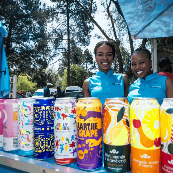 Switch Energy Drink Jelly Babies display at outdoor event with brand ambassadors.