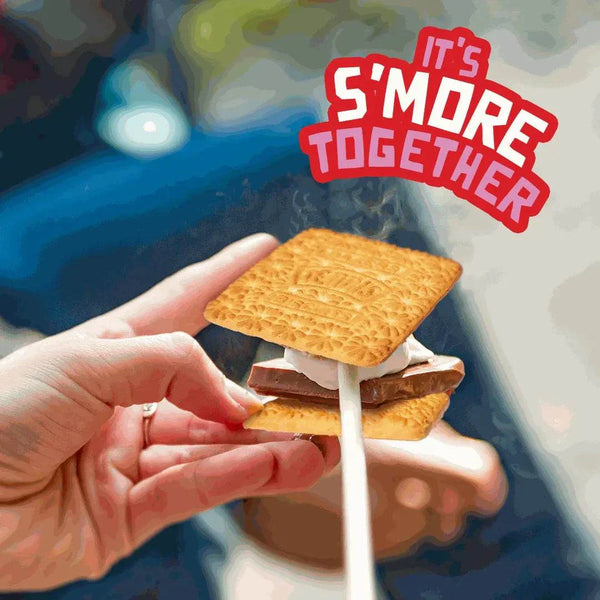Person holding a marshmallow and chocolate s'more with Bakers Tennis Biscuit.
