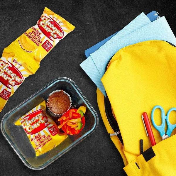 Cheese Curls snack with school supplies and lunchbox contents.