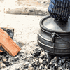 New potjie pot with protective wax layer on cast iron cookware surface