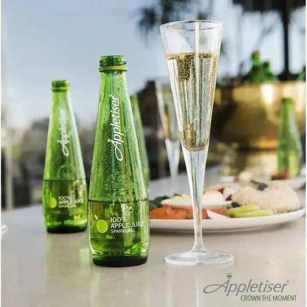 Appletiser sparkling apple juice bottles with a glass