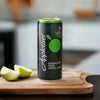 Appletiser 300ml can beside sliced green apple